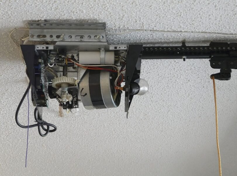 Technician performing garage door opener repair in Englewood, FL